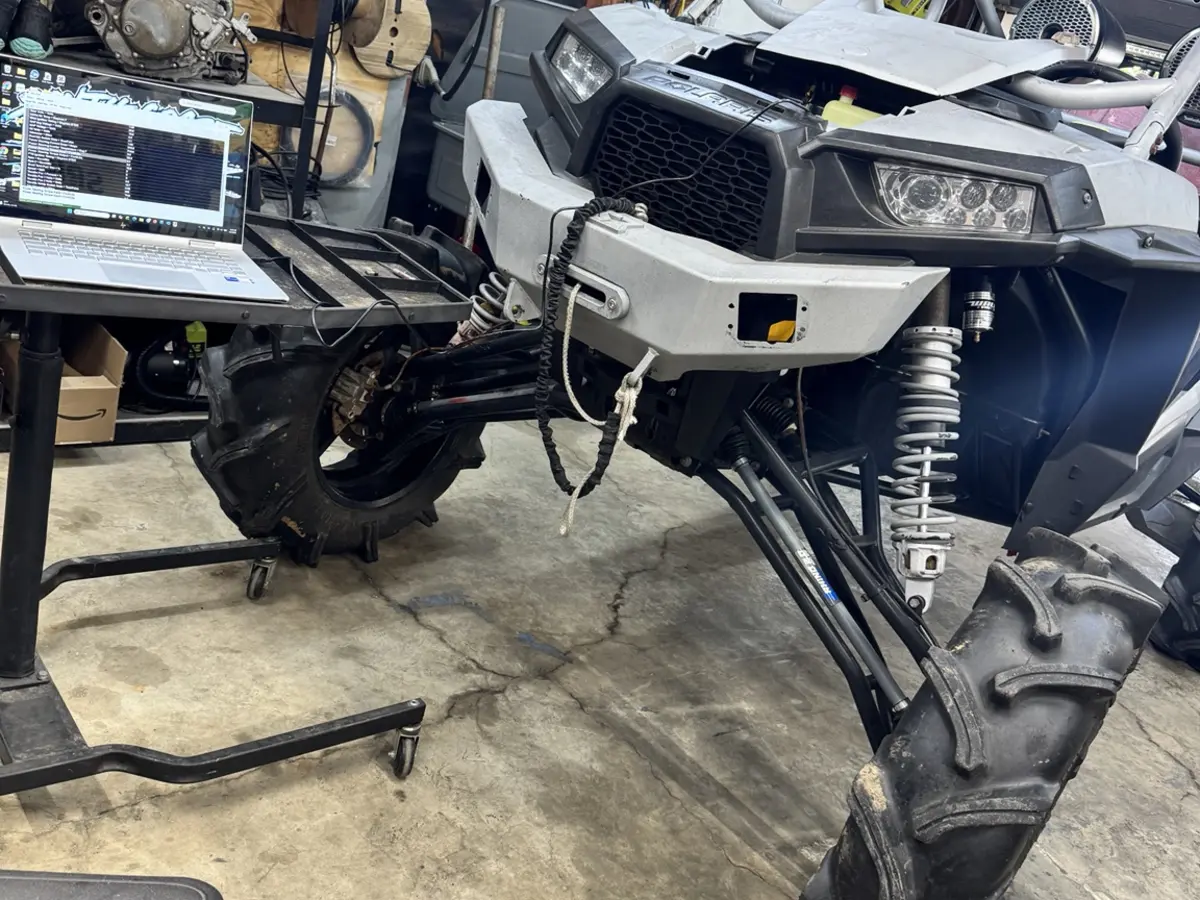 Computer diagnostics being performed on a Polaris side-by-side