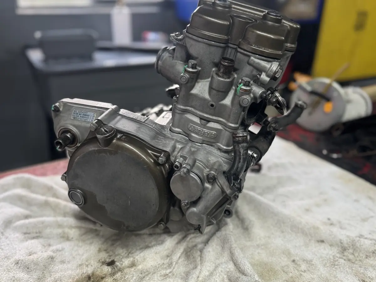 Side-by-side engine repair and assembly on a workbench